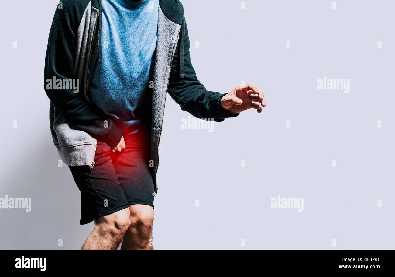 Person with urinary incontinence. Medical problem, Close up of person with crotch pain, concept of people with urinary problems Stock Photo