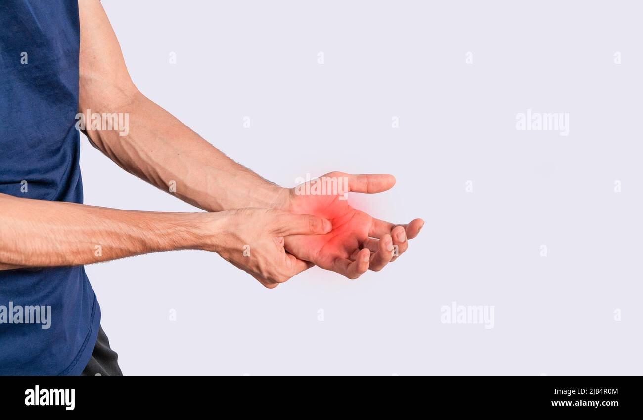 Person with palm pain, concept of a man with pain in the hands, man with arthritis rubbing, person with pain in the hands Stock Photo