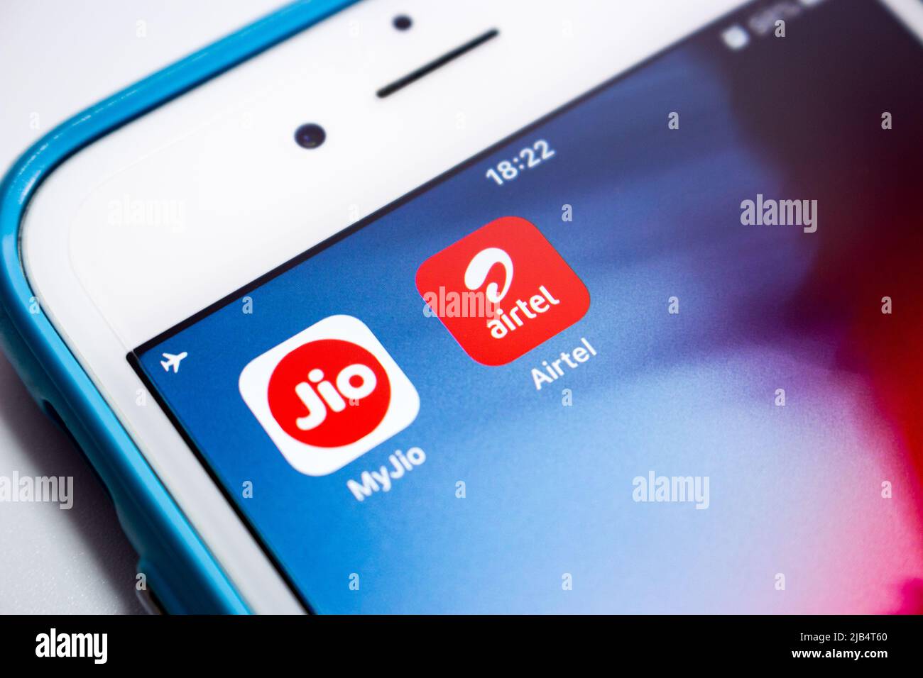 Airtel India, the 2nd largest provider of mobile telephony provider of fixed telephony in India, with MyJio by Reliance Jio Infocomm Limited on iPhone Stock Photo