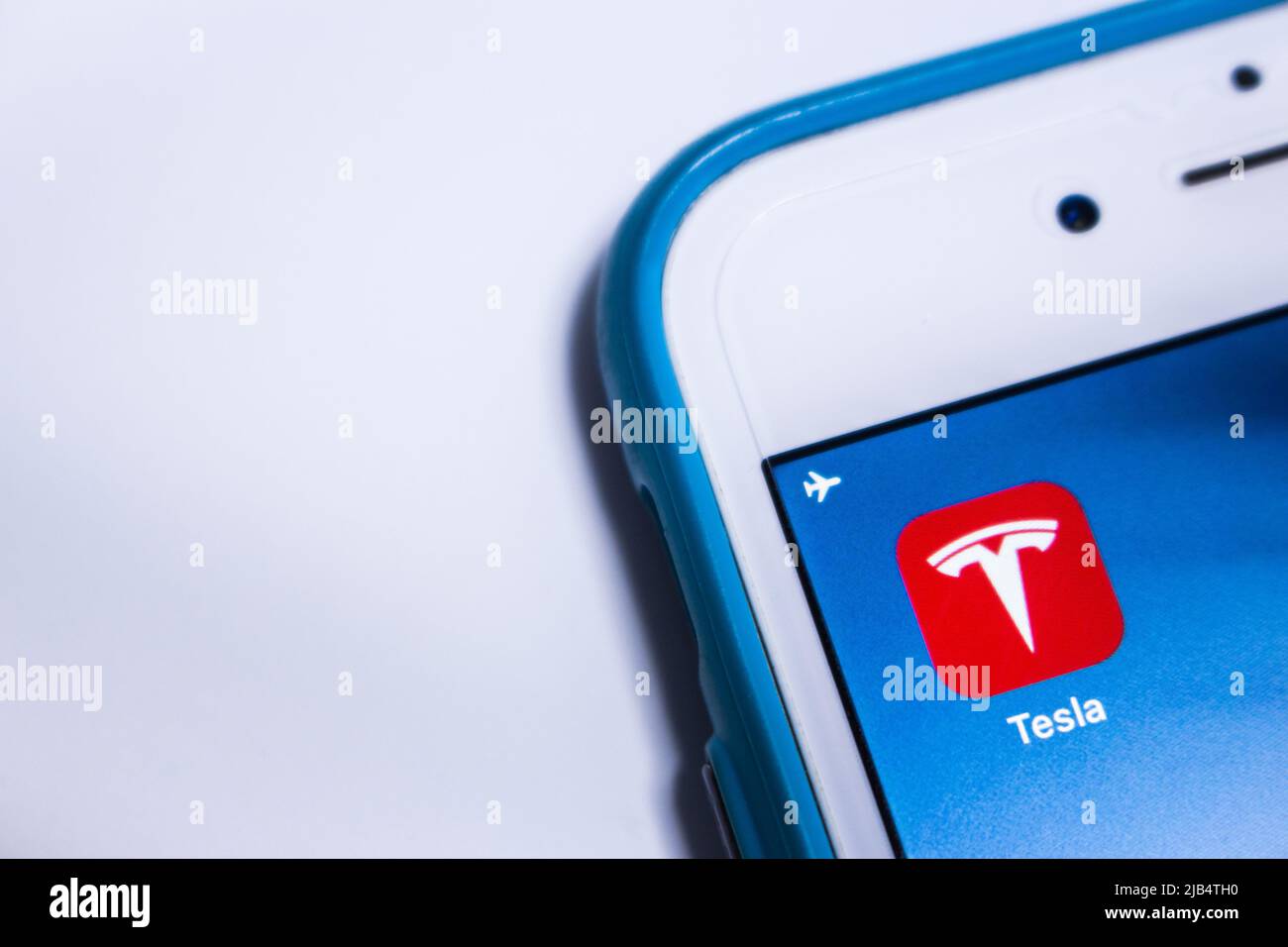 Kumamoto, Japan - Feb 7 2020: The icon of Tesla, an US electric vehicle and clean energy company Tesla, Inc., on iPhone screen. Stock Photo