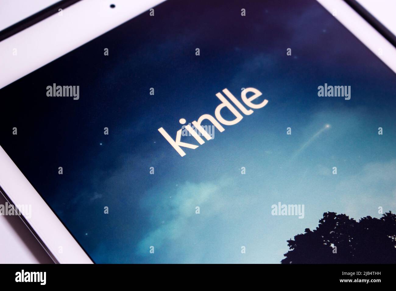 Kindle app, e-book reader by Amazon, on an iPad. From Amazon website or Kindle Store, an online e-book store by Amazon, users can purchase an e-book Stock Photo