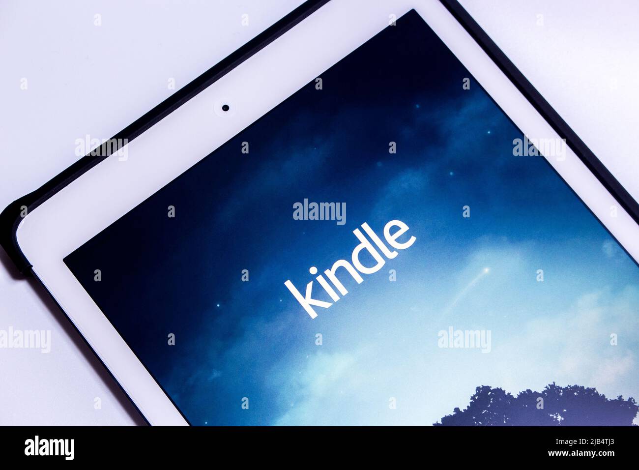 Kindle app, e-book reader by Amazon, on an iPad. From Amazon website or Kindle Store, an online e-book store by Amazon, users can purchase an e-book Stock Photo