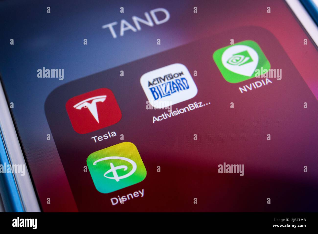 Kumamoto, Japan - Feb 20 2020: TAND (Tesla, Activision, Nvidia and Disney) apps and icons on an iPhone screen. Stock Photo