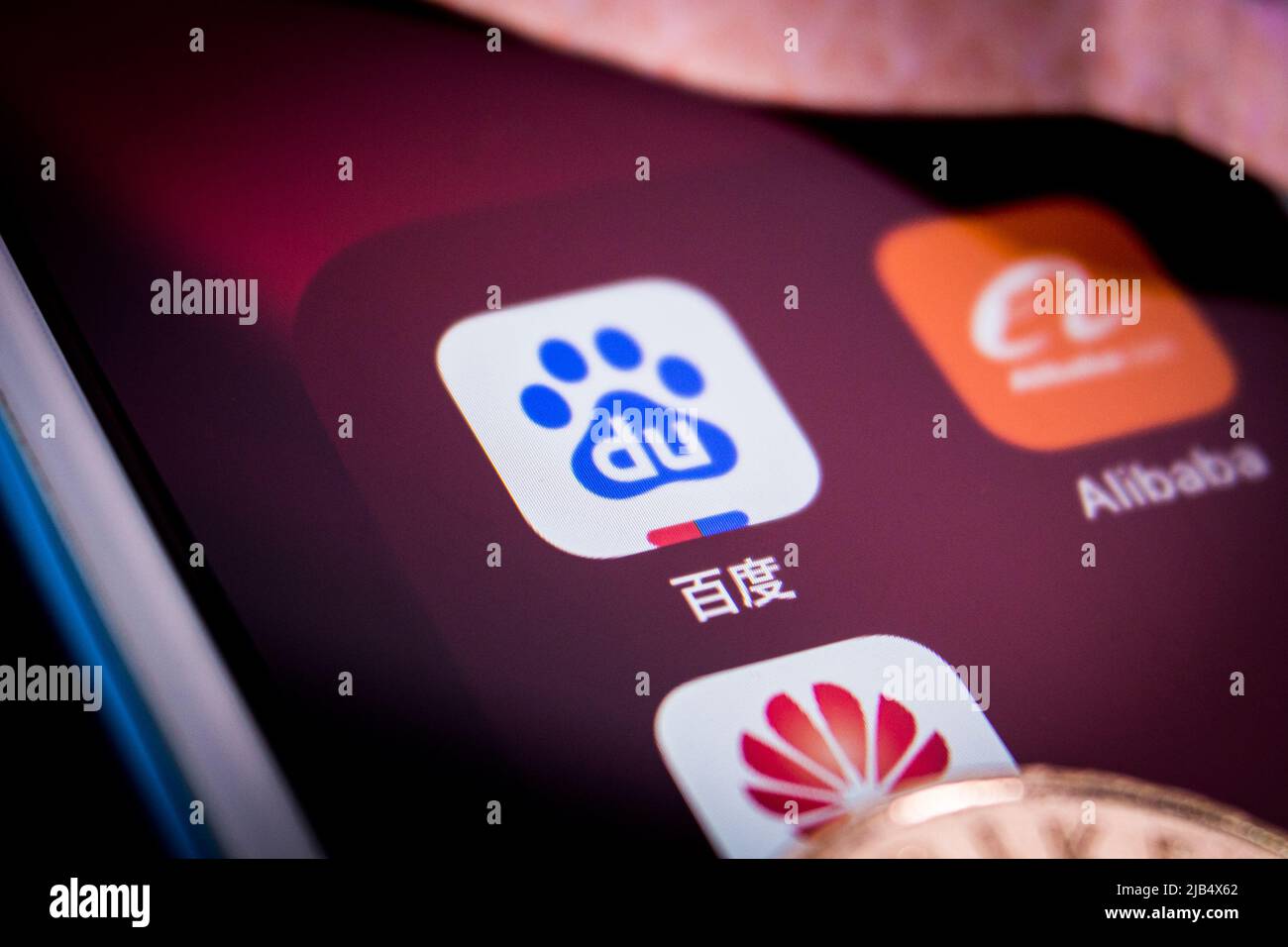 Baidu app, a Chinese tech company specializing in Internet-related services and products and AI, with China’s tech giants Alibaba & Huawei on an iOS Stock Photo