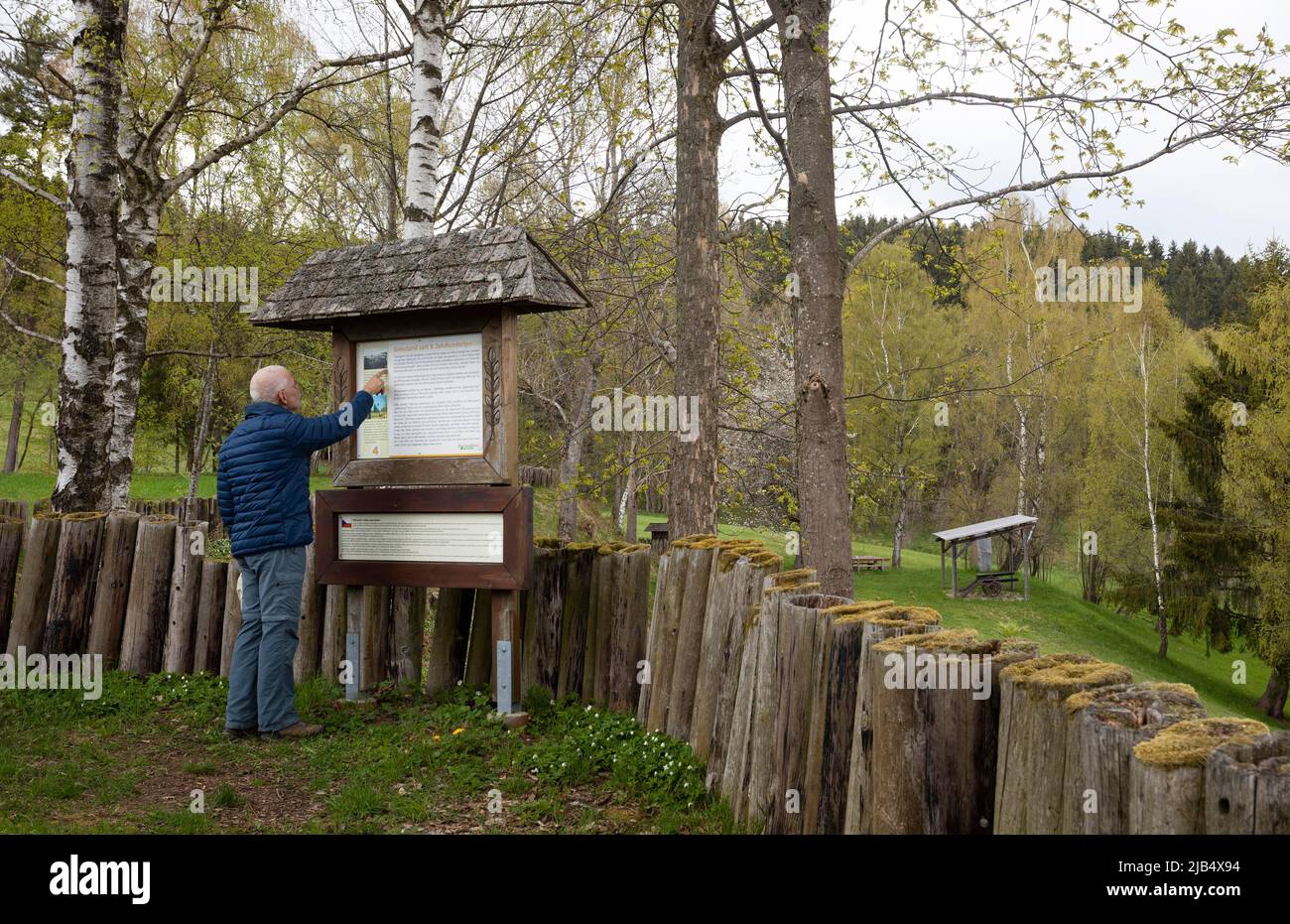 Open-air museum, hikers in front of an information board at the Schwedenschanze near Rading on the old Upper Austrian-Bohemian salt road, Bad Stock Photo