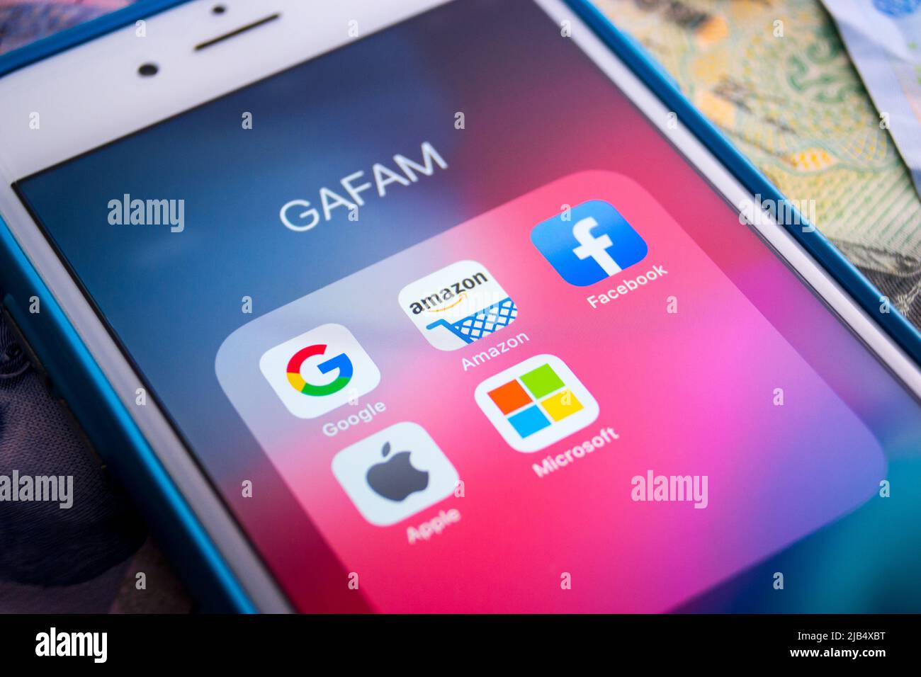 GAFAM apps on iPhone on money. Google, Amazon, Facebook, Apple & Microsoft are 5 multinational IT companies that dominated cyberspace during 2010s Stock Photo