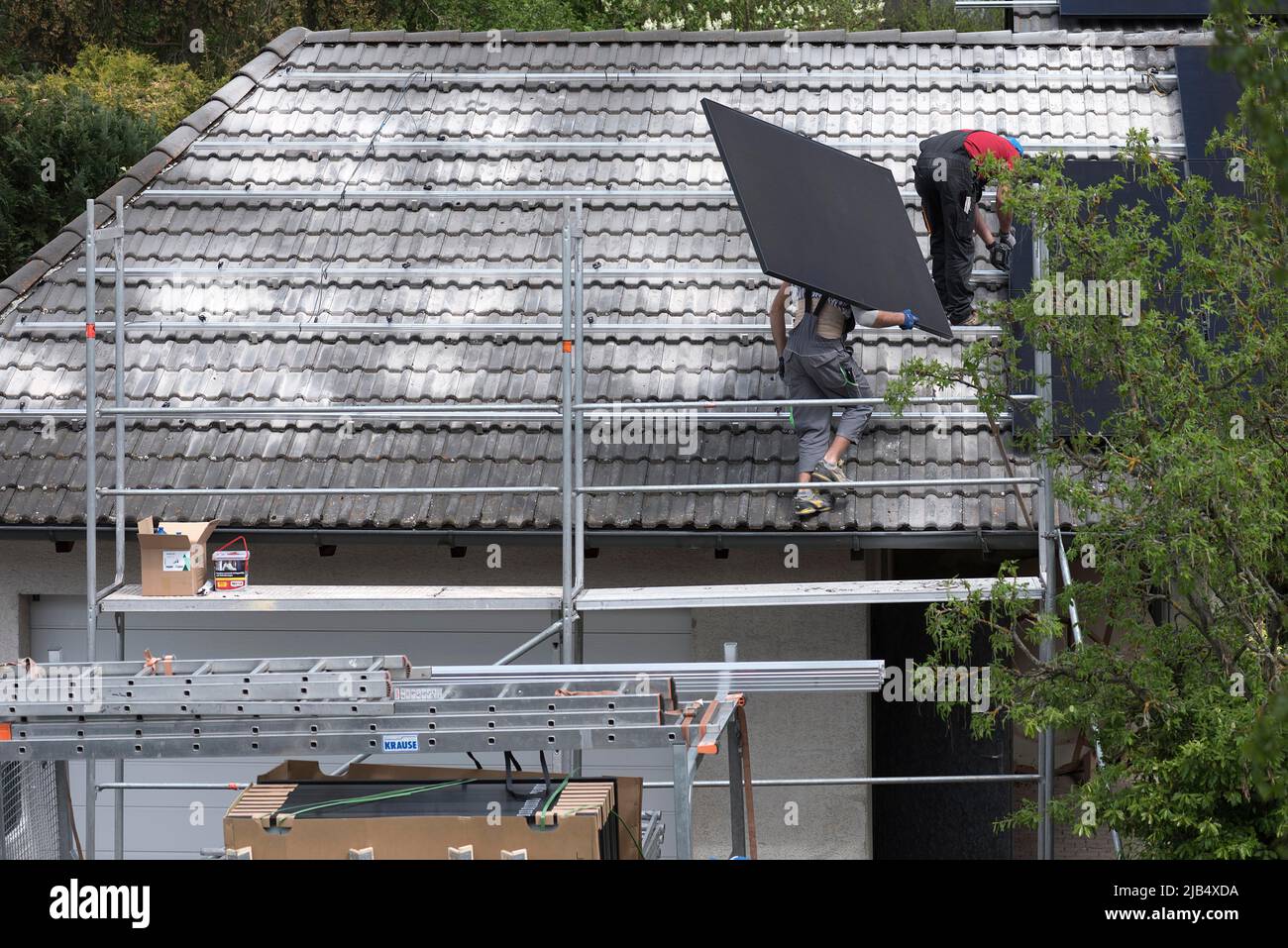 Installation of photovoltaic panels on a garage roof, Bavaria, Germany
