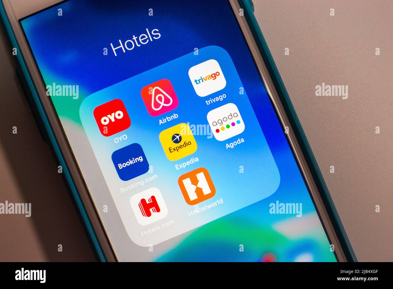 Hotel chain, travel agencies & booking companies on iPhone (OYO, Airbnb Trivago, Booking.com, Expedia, Agoda, Hotels.com & Hostelworld). Stock Photo