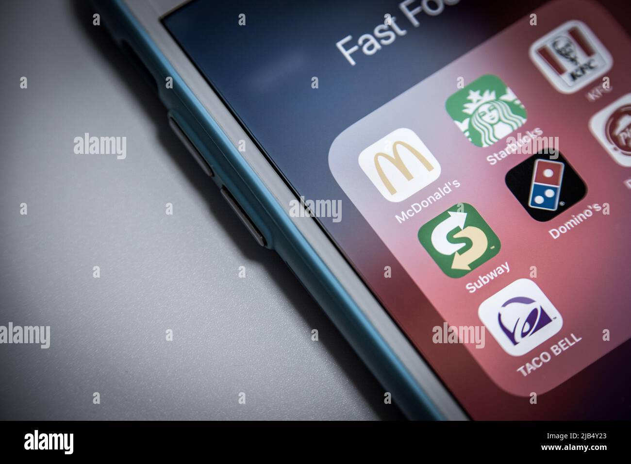 Icons of Mcdonald’s with US chain restaurant, cafe and takeaway delivery brands (Starbucks, KFC, Subway, Domino’s, PizzaHut and Taco Bell) on iOS Stock Photo