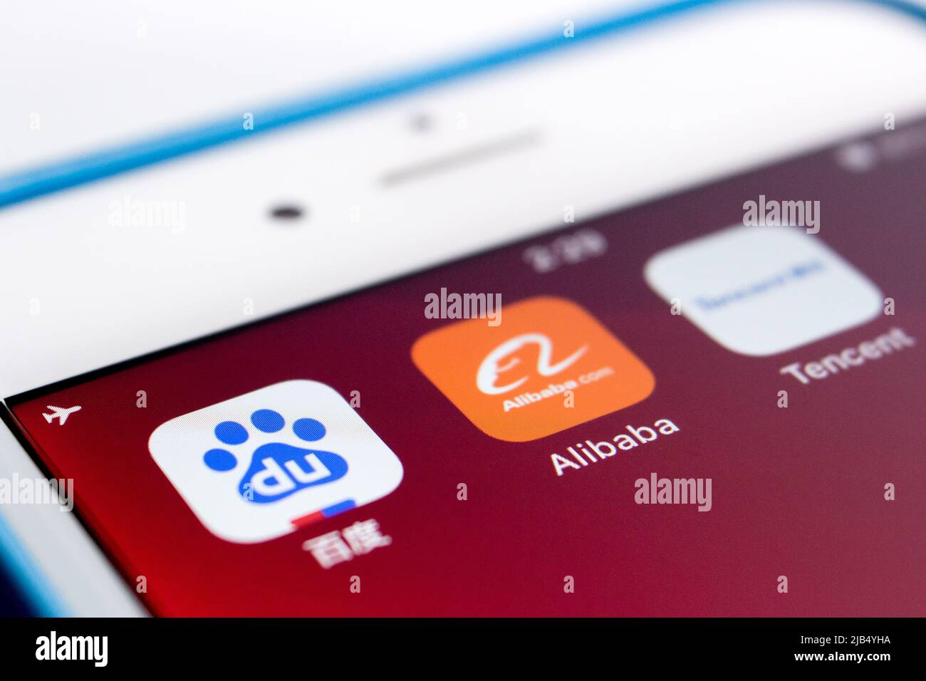 Close up of Alibaba logo, founded on 4 April 1999 in Hangzhou, Zhejiang, with Chinese big tech company logos (Baidu, Tencent and Huawei) on an iPhone. Stock Photo