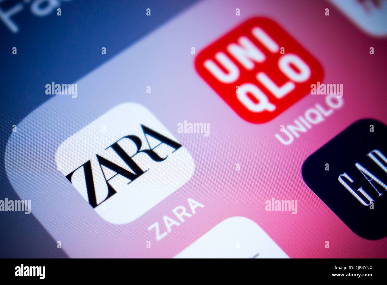 Logo of Zara, a Spanish apparel retailer based in Galicia, on iOS. Zara specializes in fast fashion, and products include clothing and accessories Stock Photo