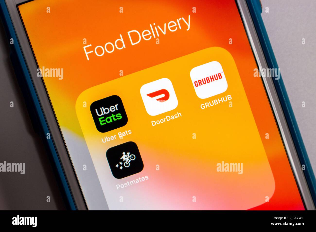 Kumamoto, Japan - May 7 2020 : 4 US popular prepared food delivery service brand logos (Uber Eats, DoorDash, Grubhub & Postmates) on iPhone. Stock Photo