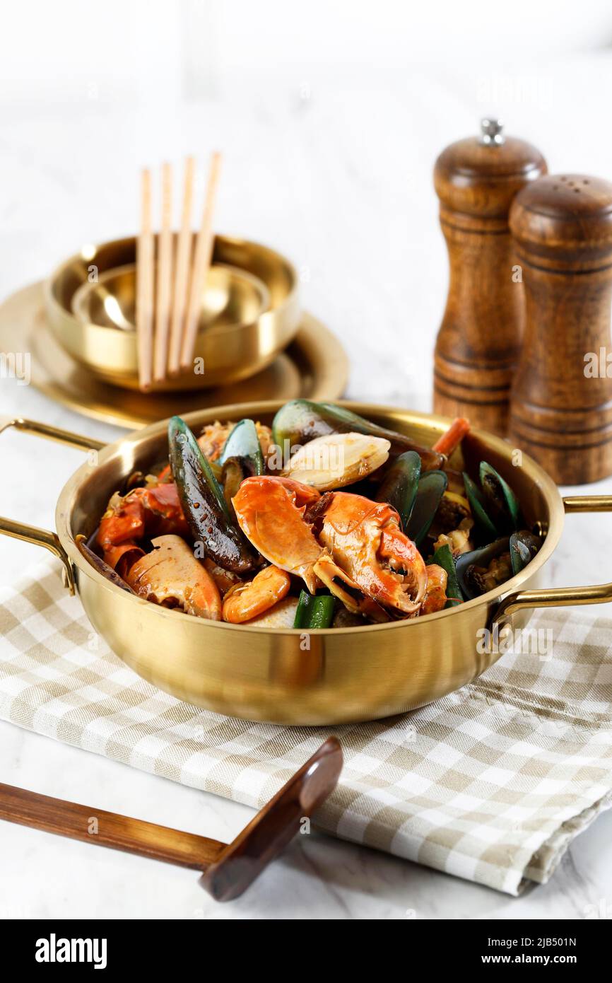 Mix Spicy Crab, Mussels, Clams, Shrimp Soup on Golden Pan, Jjampong