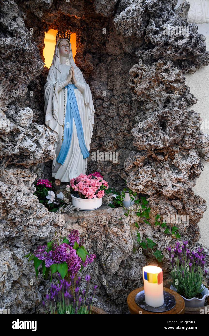 Lourdes Grotto with Madonna figure, St. Peter and Paul's Parish Church, 'Cathedral of the Western Allgaeu', neo-baroque church from 1914 Stock Photo
