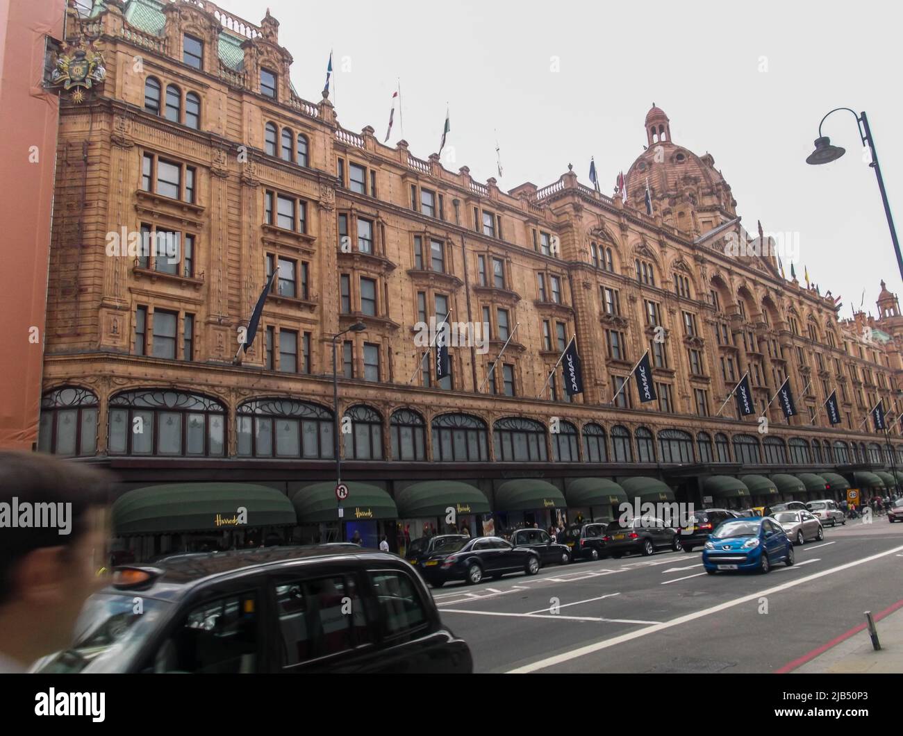 Harrods, a department store located on Brompton Road in Knightsbridge, in cloudy day. It is one