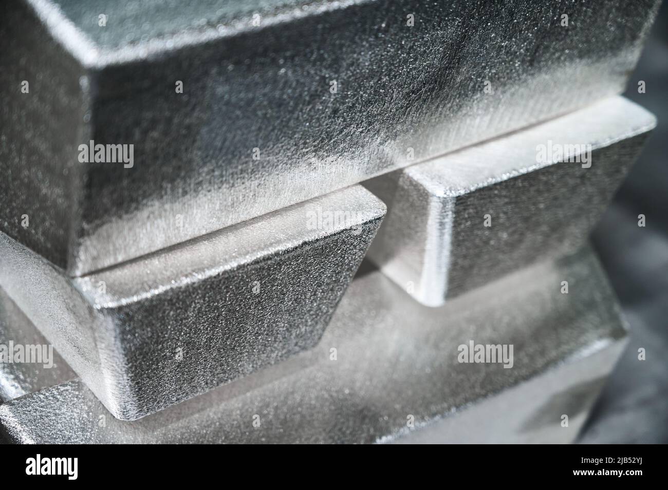 Pile of industrial silver bars at bright light in storage Stock Photo