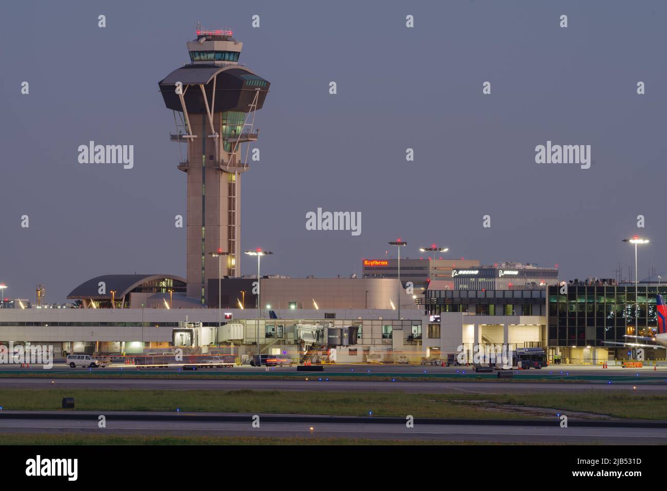Los Angeles International Airport control tower and runway shown at dusk in  California, USA on March 17, 2019. Stock Photo