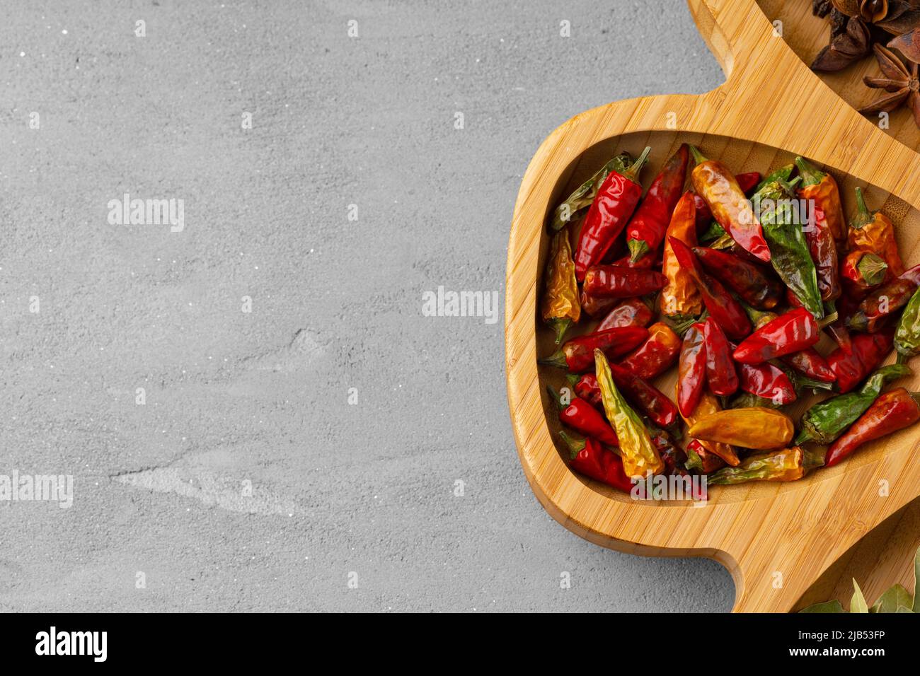 Various spices and herbs on gray background Stock Photo