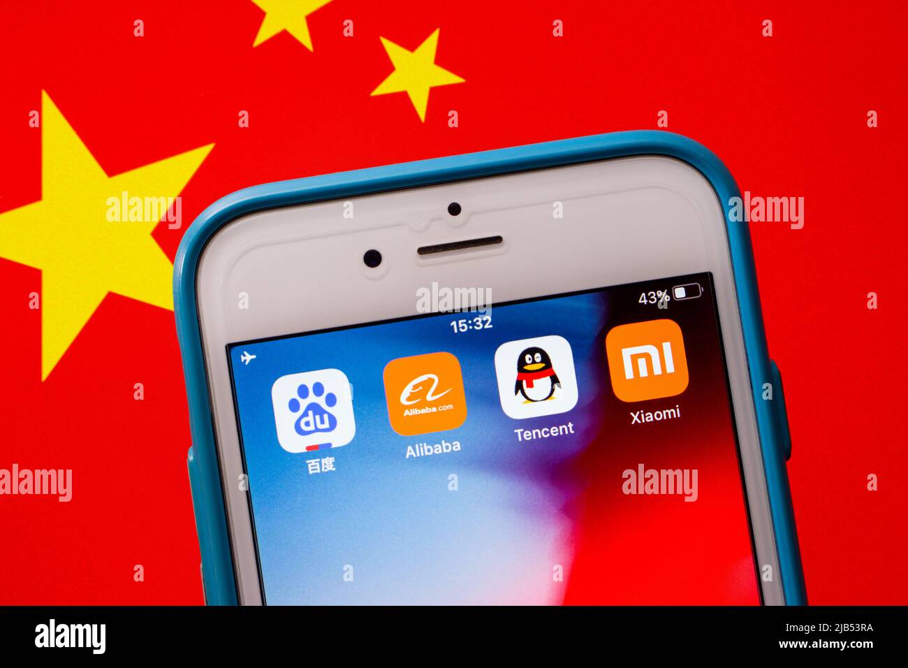 BATX China big tech (Baidu, Alibaba, Tencent & Xiaomi) on iPhone on Chinese flag. BATX is counter-standing by GAFA (Google, Amazon, Facebook & Apple) Stock Photo