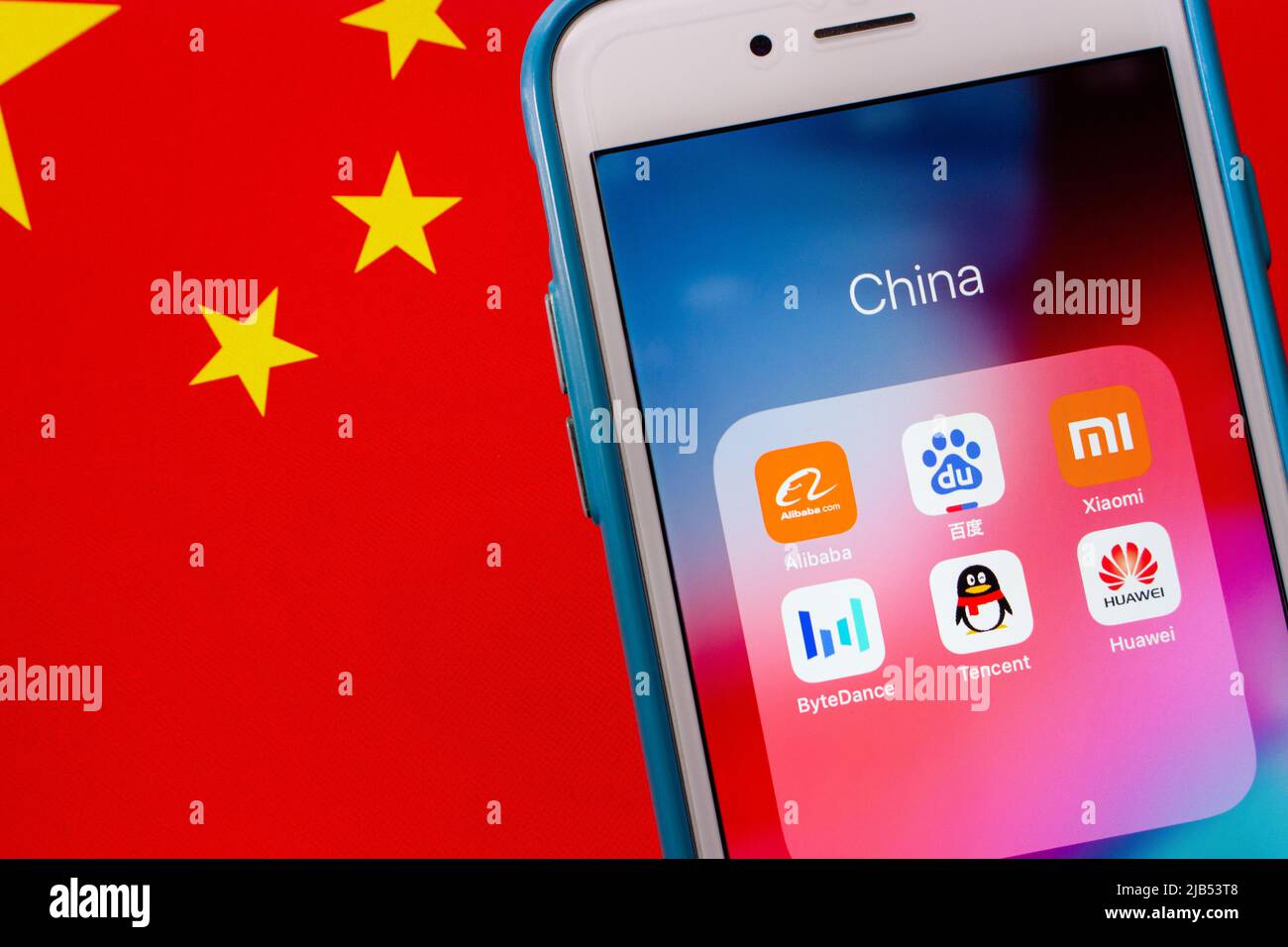 Kumamoto, JAPAN - Oct 2 2020: China's tech giants (The Big Six - Alibaba, Baidu, Tencent, ByteDance, Xiaomi and Huawei) on iPhone on Chinese flag Stock Photo