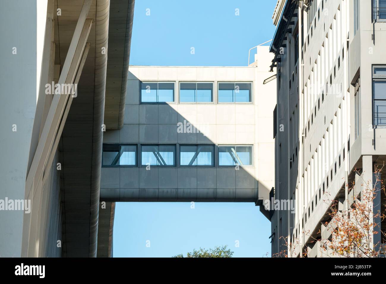 Skybridge or skyway system which is an interconnecting bridge between two buildings closeup on a building showing architectural elements and design Stock Photo