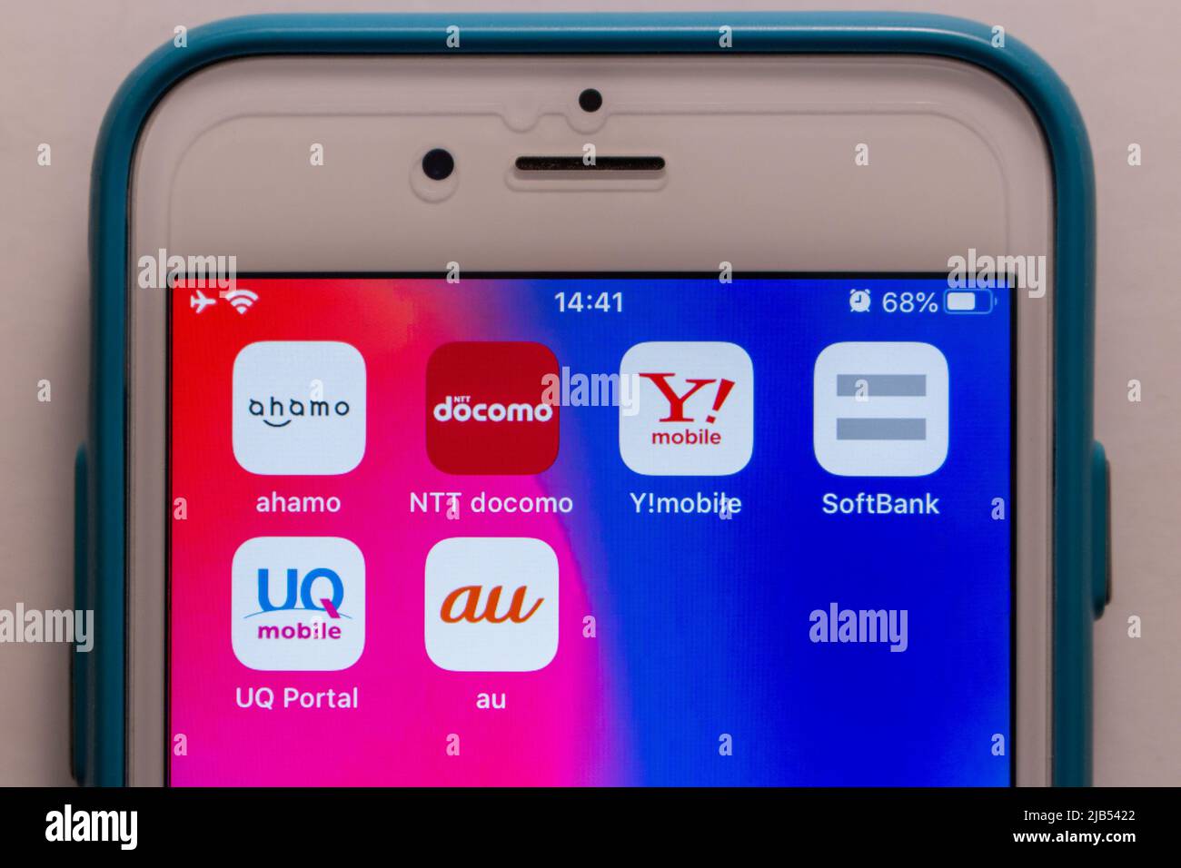 3 giant mobile carriers in Japan (au by KDDI, NTT docomo and SoftBank) with their subsidiary mobile brands Ahamo, Y!mobile, UQ Mobile on iPhone. Stock Photo