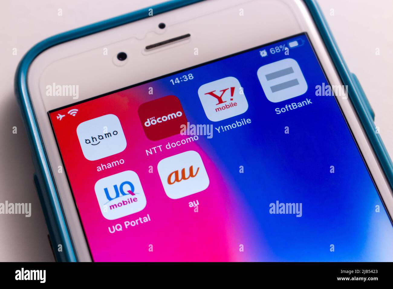 3 giant mobile carriers in Japan (au by KDDI, NTT docomo and SoftBank) with their subsidiary mobile brands Ahamo, Y!mobile, UQ Mobile on iPhone. Stock Photo