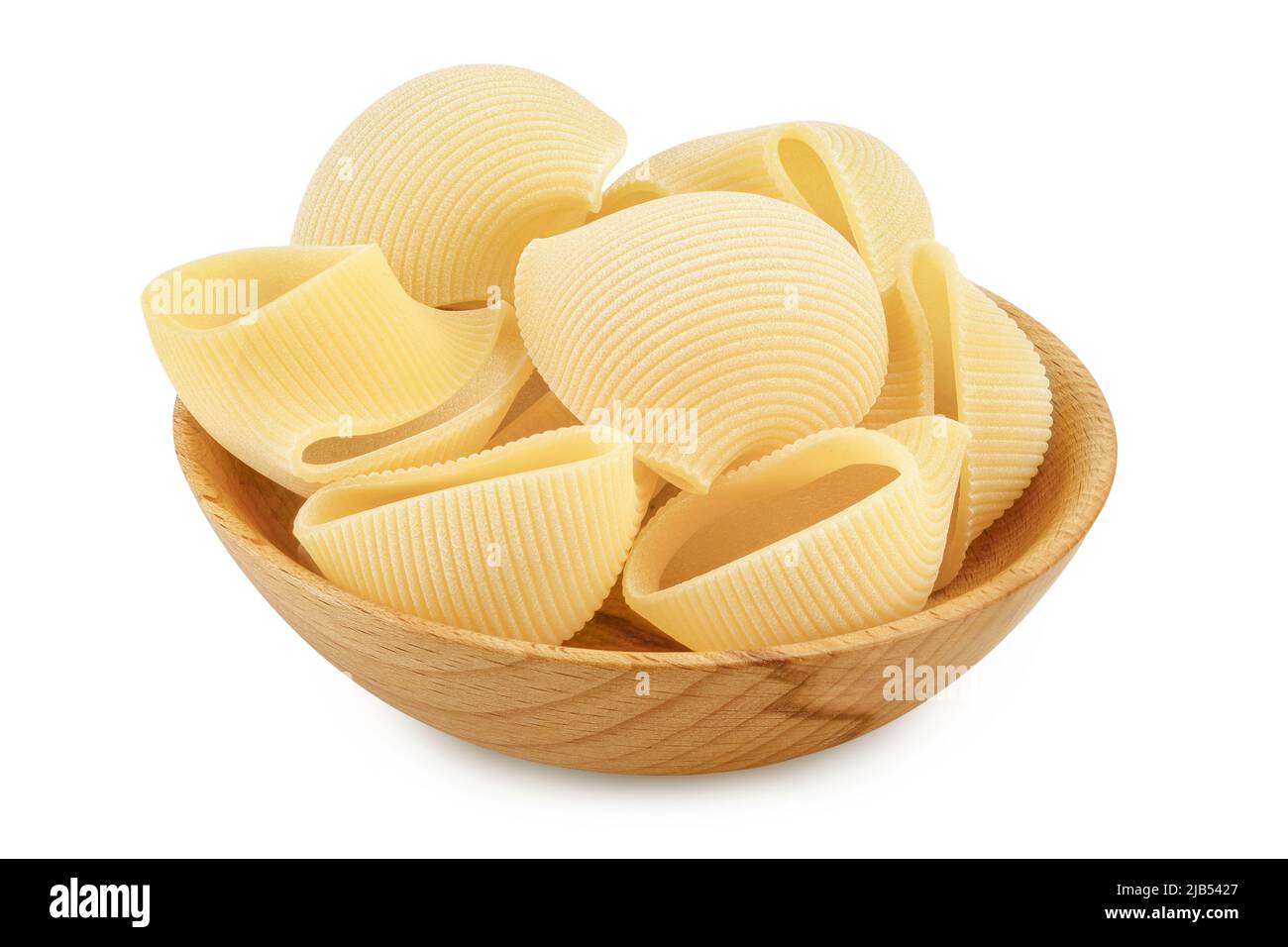lumaconi pasta in wooden bowl isolated on white background with full depth of field Stock Photo