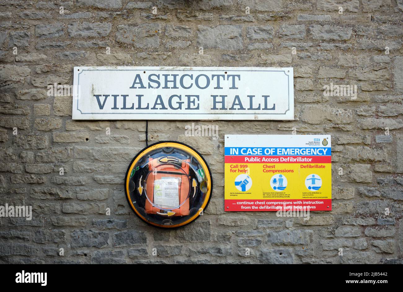 A defibrillator attached to a village hall in Somerset, England Stock Photo
