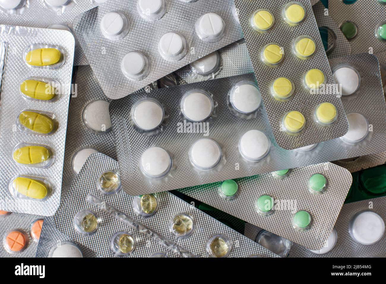 Medicine cabinet with pill bottles and syringe Stock Photo - Alamy