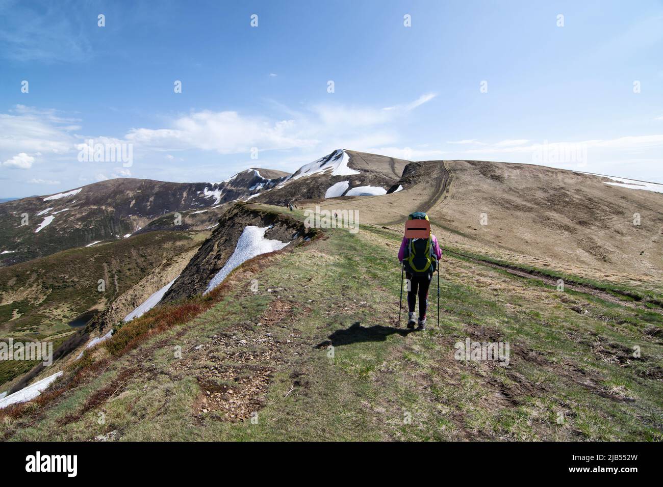A group of tourists with backpacks moves along the ridge, the Ukrainian ...