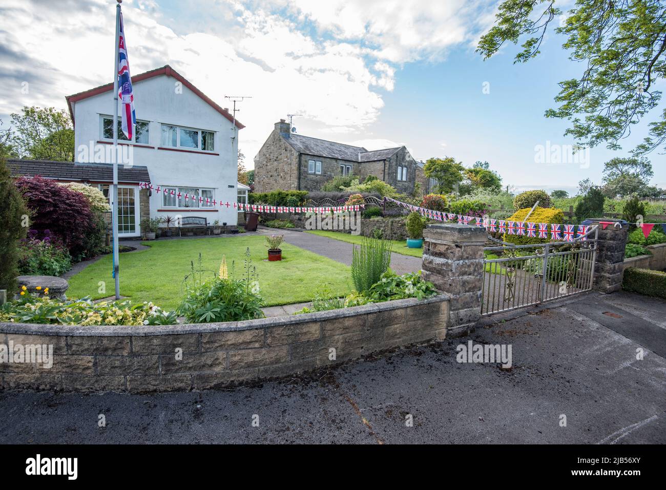 Flags and bunting in Chapel Walk, Long Preston, North Yorkshire in
