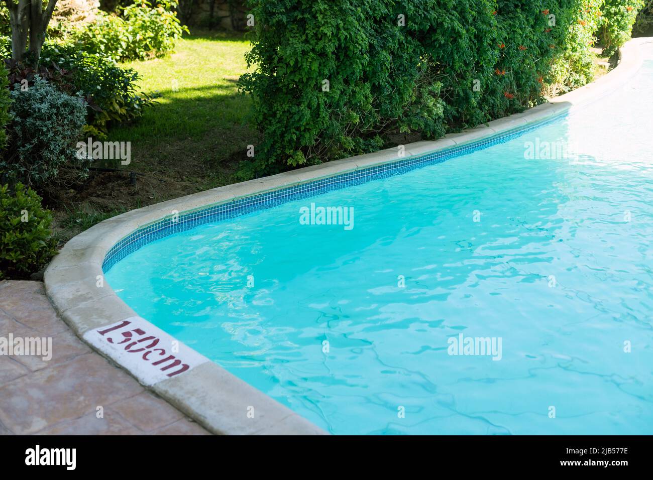 Hotel swimming pool water background Stock Photo - Alamy