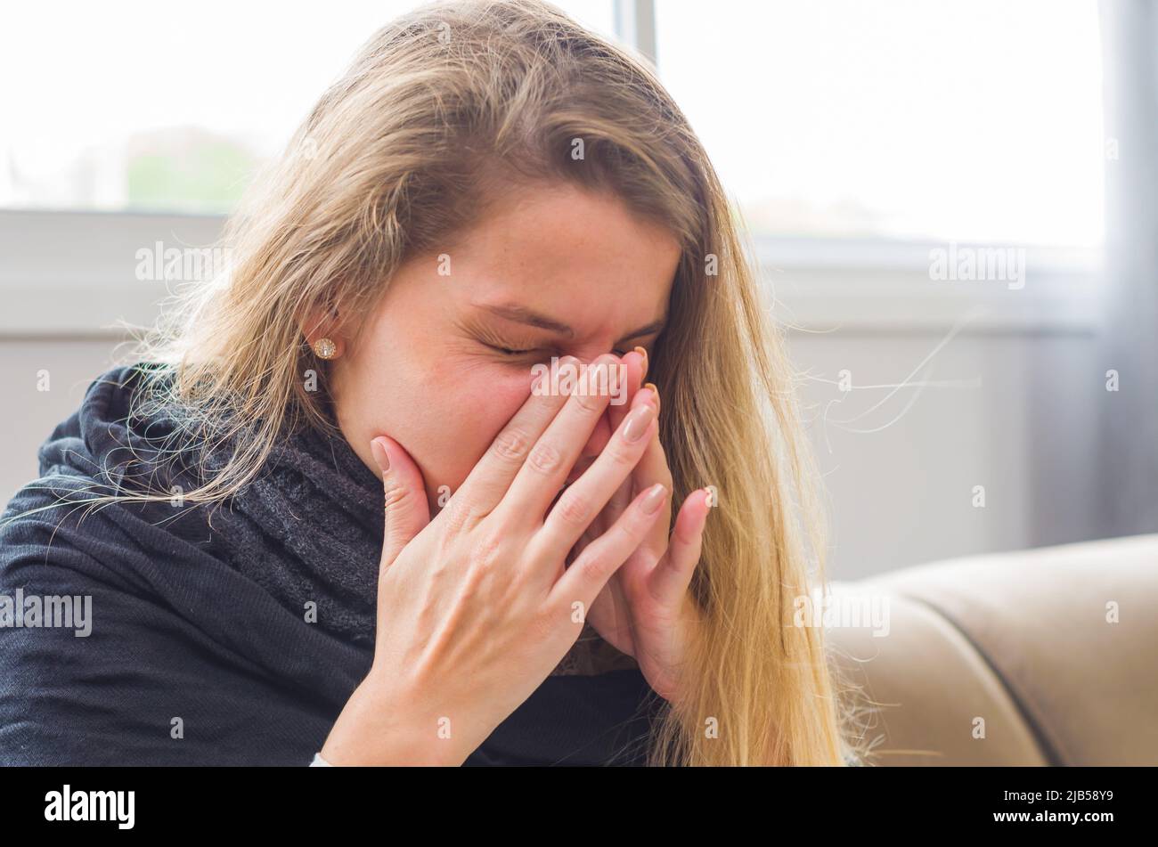 Great concept of allergy, rhinitis, cough. Young blonde woman coughing