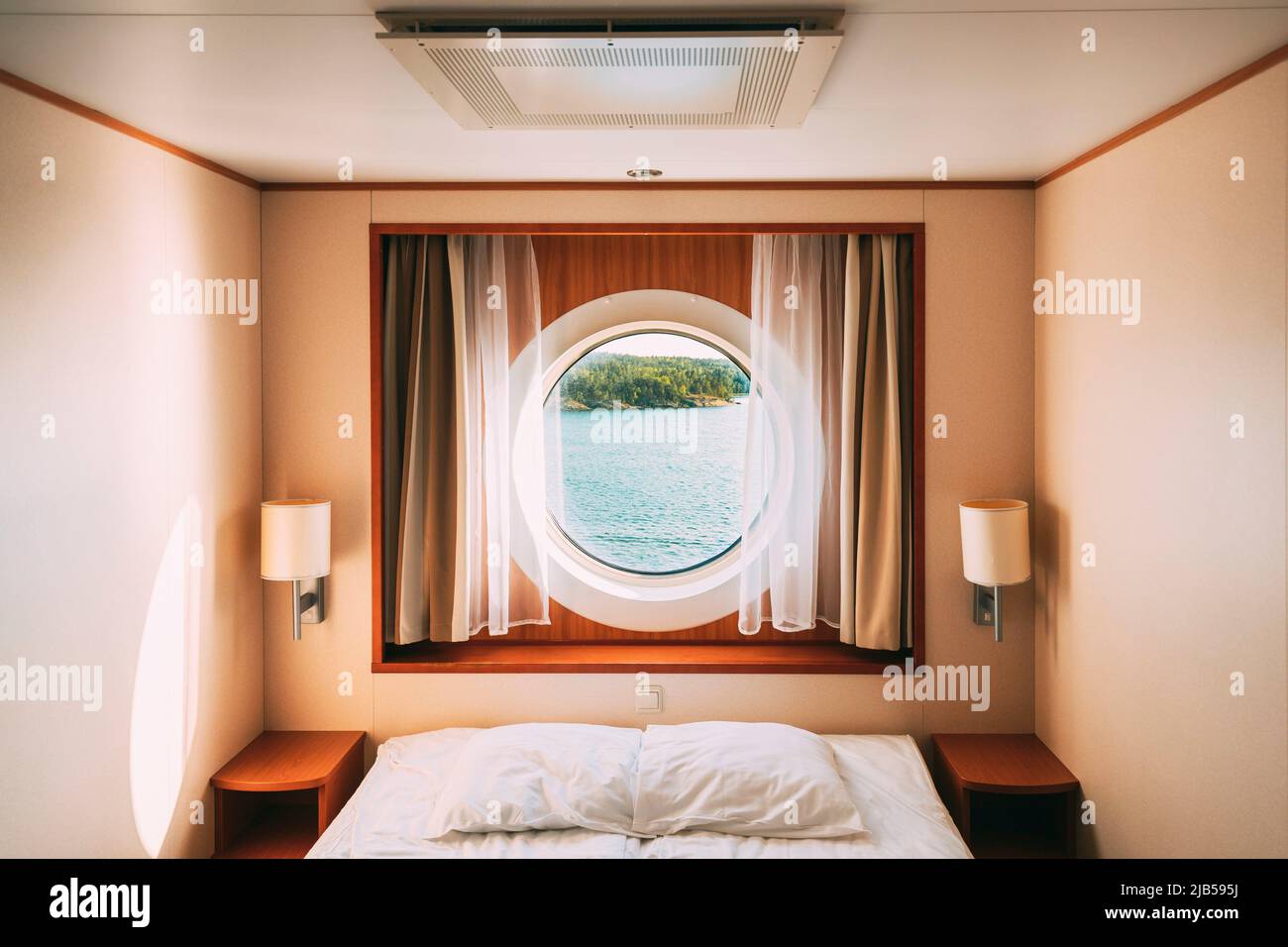 Ship Window In Craft Cabin With Bed. View On Sea. Luxury Cabin On Ferry Boat  Or Cruise Liner. Sea Cruise Vacation Trip Travel Concept Stock Photo - Alamy