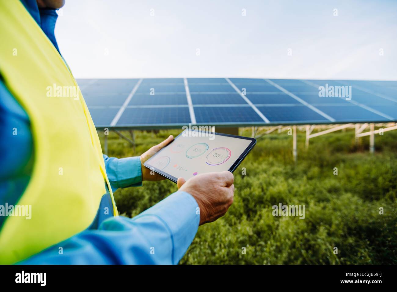 Tablet Using Solar Panel Worker using tablet for setting solar system. Eco concept Stock Photo ...