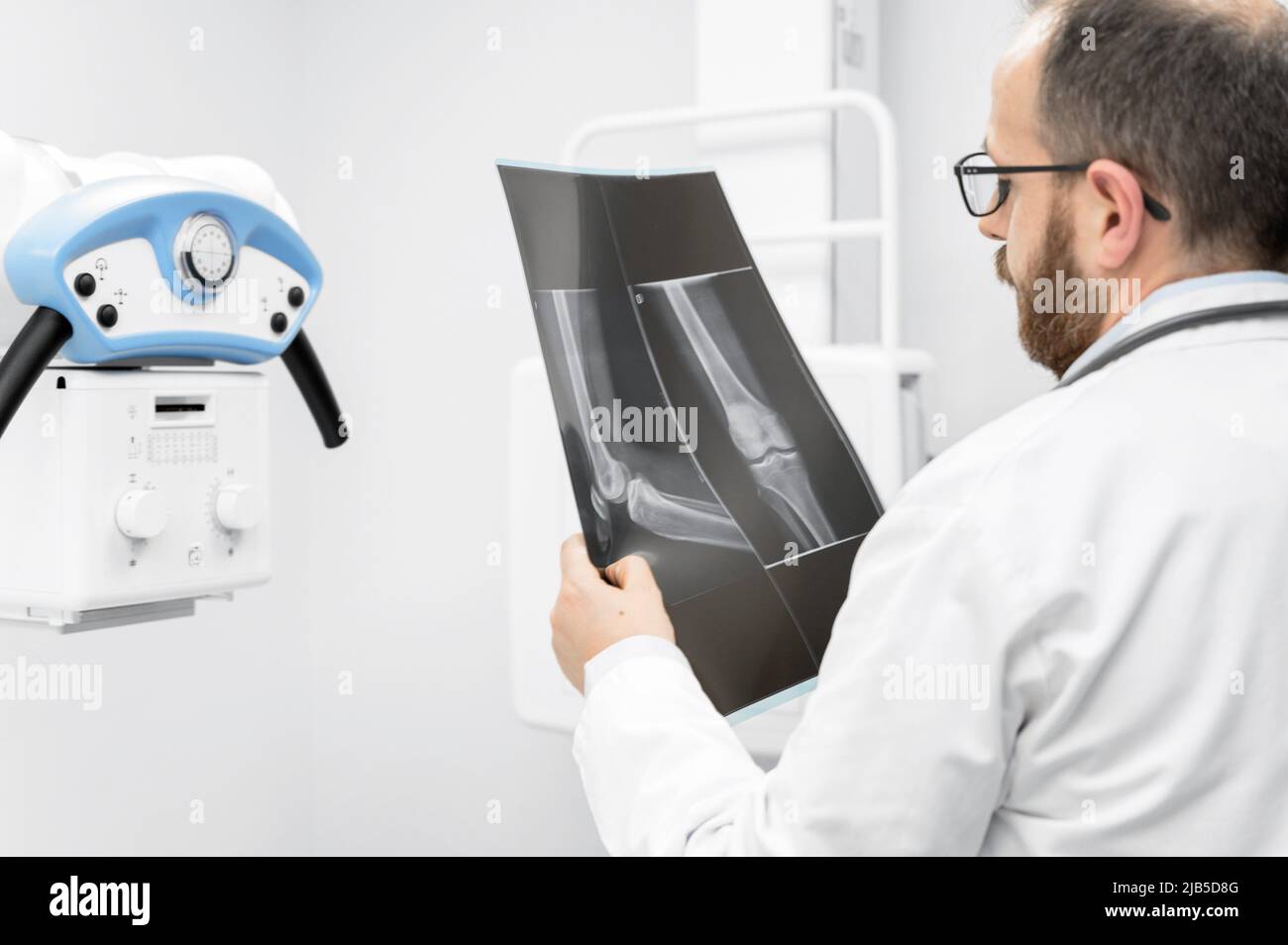 Doctor examine a film x-ray of a patient at radiology room. High quality photography. Stock Photo
