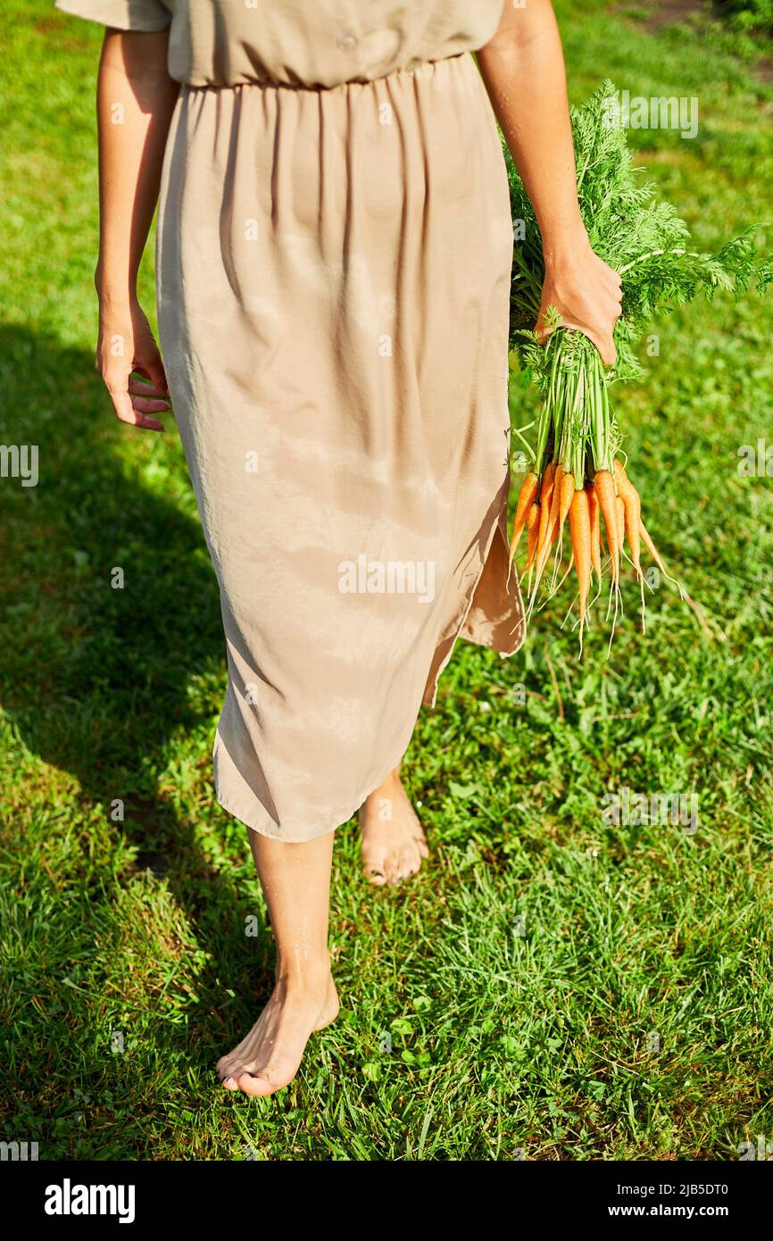 Woman walking barefoot on grass hi-res stock photography and images - Alamy