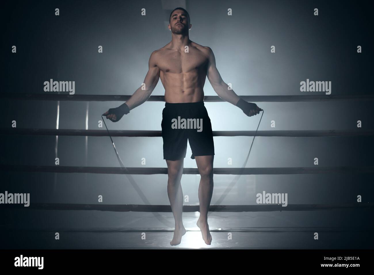 Boxer jumping rope in boxing ring. High quality photo. Stock Photo