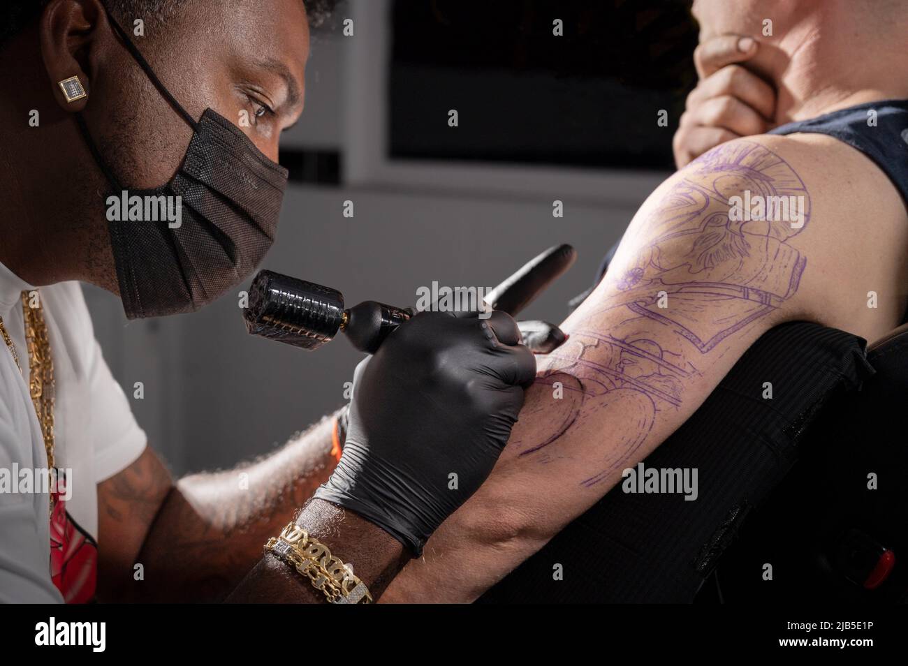 Body art at the tattoo studio. High quality photography. Stock Photo