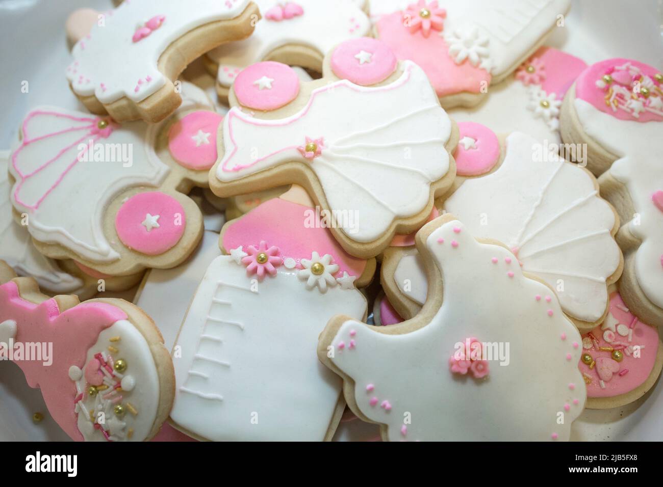 Platter full of baptism or christening cookies. Overhead view. Stock Photo
