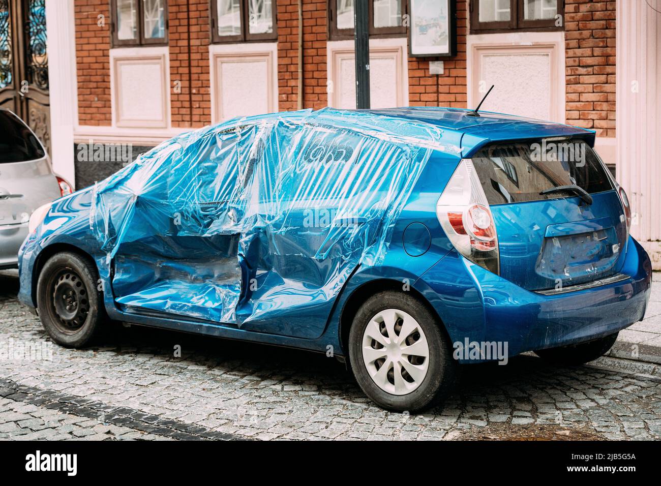 Broken Scratched And Dent Doors Side Fender blue Car after Collision. Scratched With Deep Damage