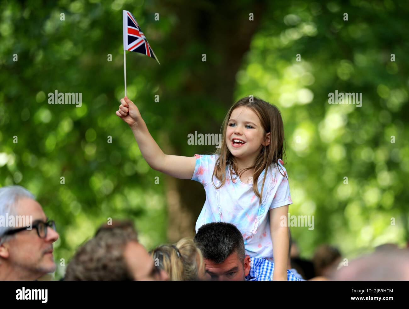 London, Britain. 2nd June, 2022. A girl watches the Trooping the Colour