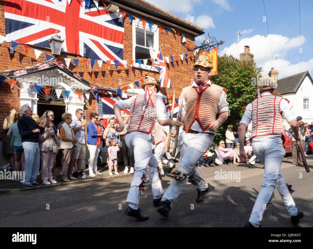 Steeple Bumpstead, Essex. 3rd June 2022. Morris Dancers from Thaxted perform outside The Red Lion public house in the quaint Essex village of Steeple Bumpstead as Jubilee celebrations continue. Credit: Jason Mitchell/Alamy Live News. Stock Photo
