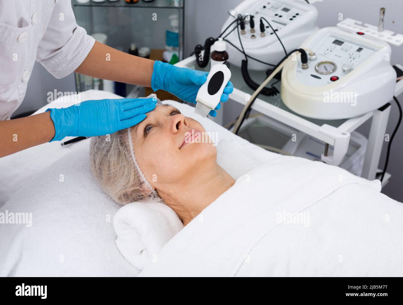 Mature woman having beauty procedures Stock Photo - Alamy