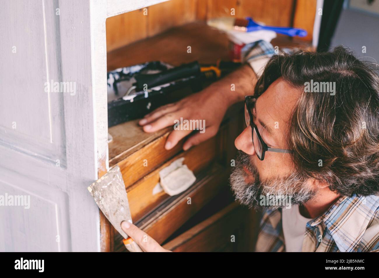 People and diy hobby work at home concept leisure activity. Adult man