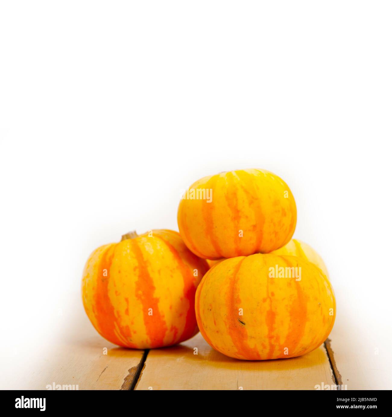 bunch of fresh yellow pumpkins just collected from garden. Stock Photo