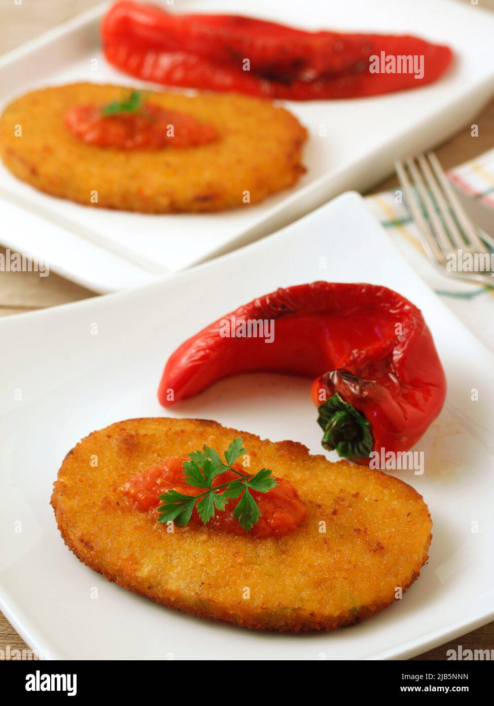 Vegetarian breaded, based on variety of veggies, with baked peppers. Stock Photo