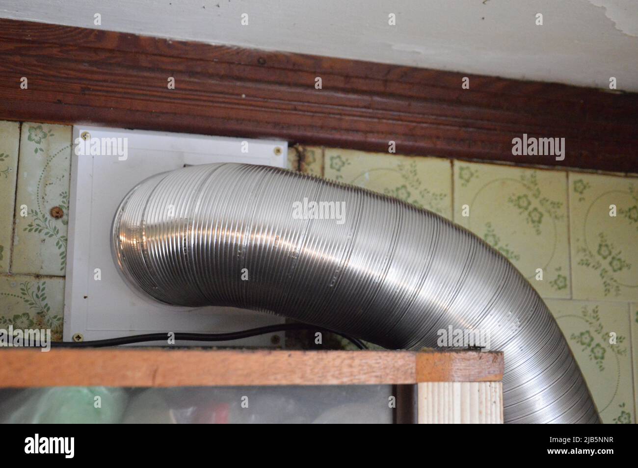Installing a kitchen hood for the ventilation. Stock Photo