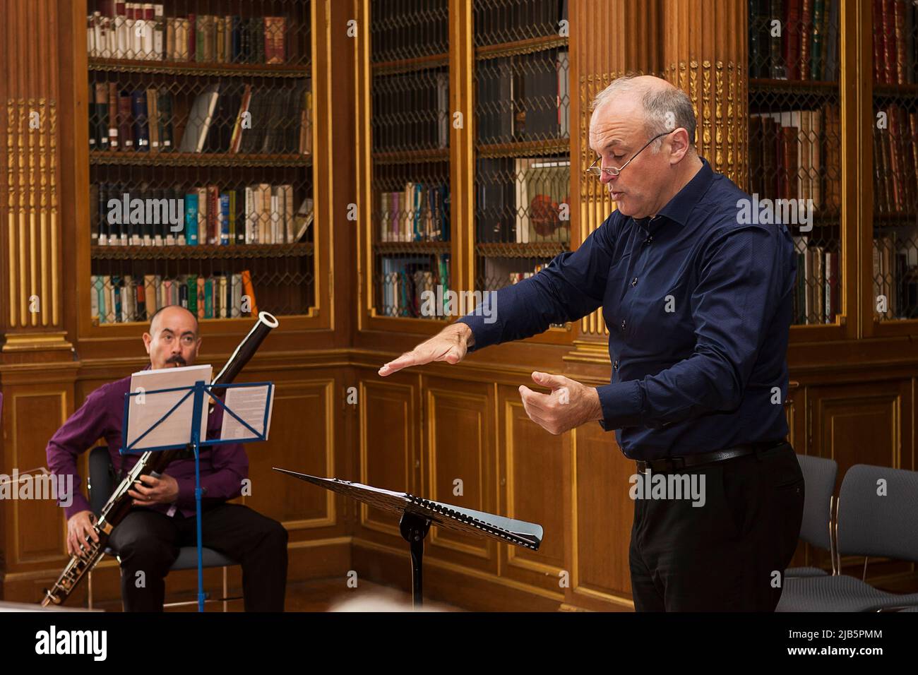 Portrait of a conductor and bassoonist fullyfocussed during a